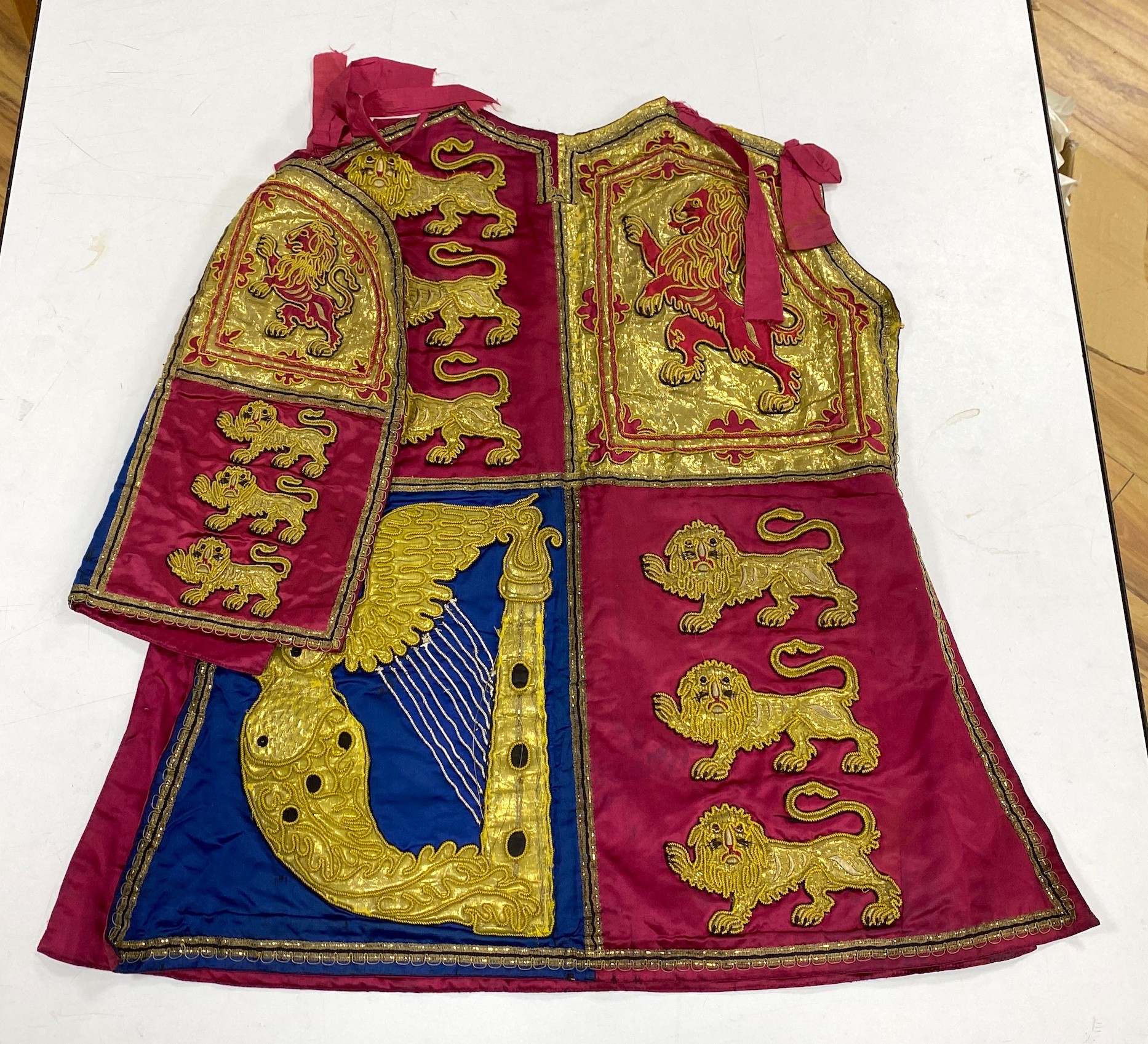 Two QEII Officer's of Arms of The Herald's College embroidered tabards and a similar silk garter, possibly worn for the Coronation of the Queen in 1953
